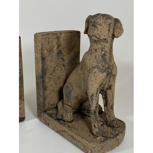 103 - A PAIR OF DECORATIVE STONE DOG BOOKENDS