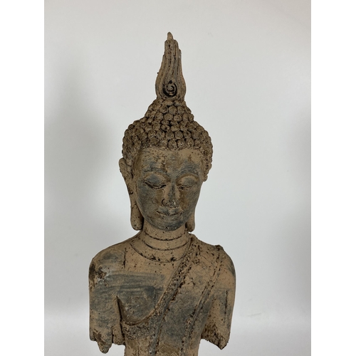 104 - A DECORATIVE STONE BUDDHA HEAD AND TORSO ON PLINTH BASE, HEIGHT 39CM