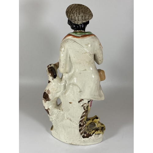 108 - AN ANTIQUE STAFFORDSHIRE FIGURE OF A GENTLEMAN WITH SPANIEL, HEIGHT 38CM