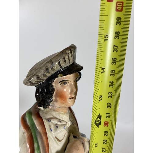 108 - AN ANTIQUE STAFFORDSHIRE FIGURE OF A GENTLEMAN WITH SPANIEL, HEIGHT 38CM