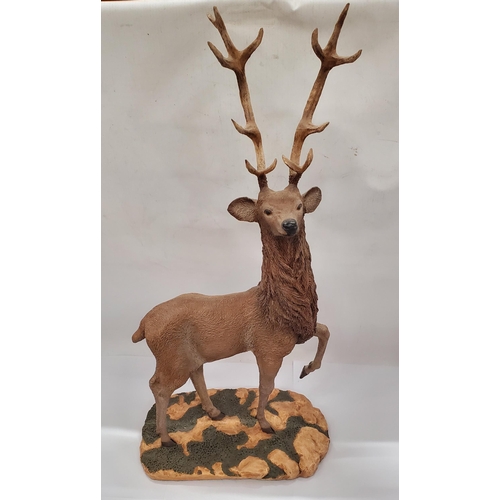 134 - A LARGE RESIN STATUE OF A STAG ON A BASE, HEIGHT 58CM TO THE TOP OF THE ANTLERS, WIDTH 28CM