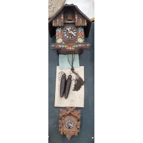 141 - TWO SWISS STYLE WOODEN CUCKOO CLOCKS WITH WEIGHTS AND INSTRUCTIONS