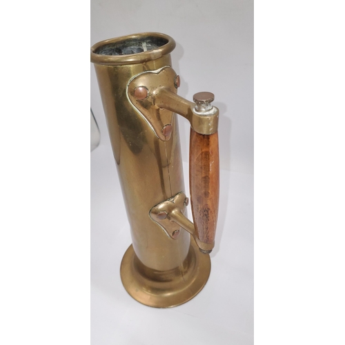 151 - A VINTAGE TALL BRASS ARTS AND CRAFTS STYLE TANKARD WITH WOODEN HANDLE, HEIGHT 29.5CM