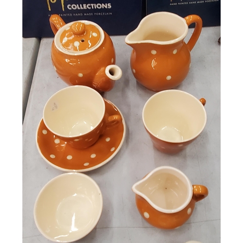 180 - A SANDYGATE POTTERY, DEVON PART TEASET TO INCLUDE A TEAPOT, CREAM JUGS, SUGAR BOWL, CUPS AND ONE SAU... 