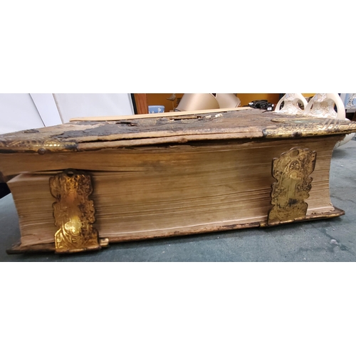 200 - A LARGE ANTIQUARIAN HOLY BIBLE WITH COLOUR AND BLACK AND WHITE PLATES, SOME DAMAGE TO THE COVER AND ... 