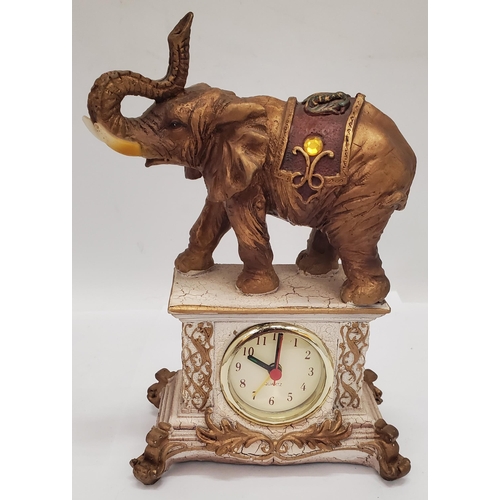 258 - A VINTAGE ST. JAMES BRASS CARRIAGE CLOCK PLUS A MANTLE CLOCK WITH AN ELEPHANT ON TOP