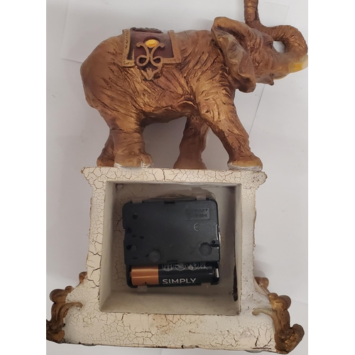 258 - A VINTAGE ST. JAMES BRASS CARRIAGE CLOCK PLUS A MANTLE CLOCK WITH AN ELEPHANT ON TOP