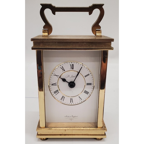 258 - A VINTAGE ST. JAMES BRASS CARRIAGE CLOCK PLUS A MANTLE CLOCK WITH AN ELEPHANT ON TOP