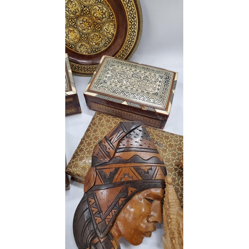 287 - A QUANTITY OF TREEN ITEMS TO INCLUDE BOXES, TWO INLAID WITH MOTHER OF PEARL, A MASK, WALL PLAQUES, S... 