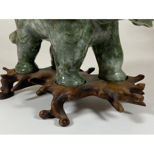 300 - A PAIR OF CHINESE JADEITE / JADE HARDSTONE ELEPHANT MODELS ON CARVED WOODEN STANDS, HEIGHT 16CM, LEN... 