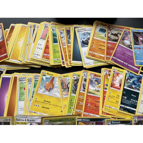 116 - TWO TINS OF ASSORTED POKEMON CARDS, HOLOS ETC