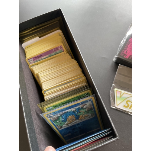 117 - A TRAINER BOX OF ASSORTED POKEMON CARDS, GAME TOKENS, HOLOS ETC