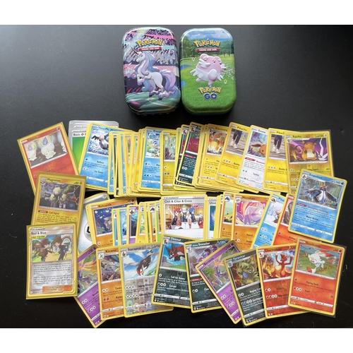 118 - TWO TINS OF ASSORTED POKEMON CARDS, HOLOS ETC