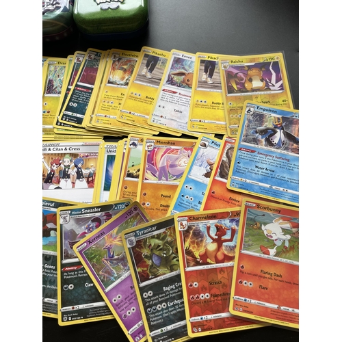 118 - TWO TINS OF ASSORTED POKEMON CARDS, HOLOS ETC