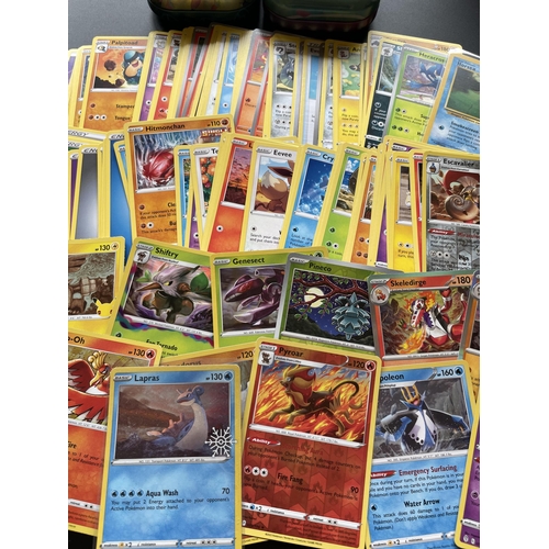 312 - TWO TINS OF ASSORTED POKEMON CARDS, HOLOS ETC