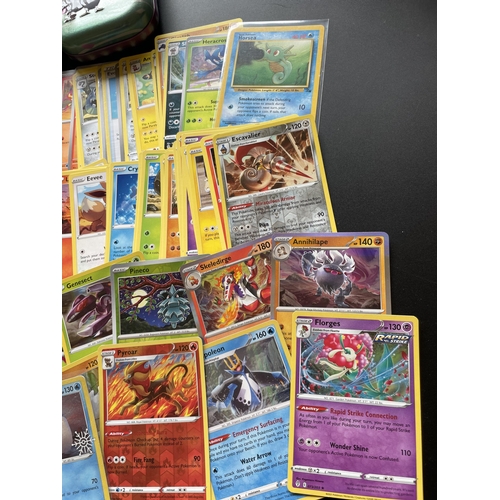 312 - TWO TINS OF ASSORTED POKEMON CARDS, HOLOS ETC