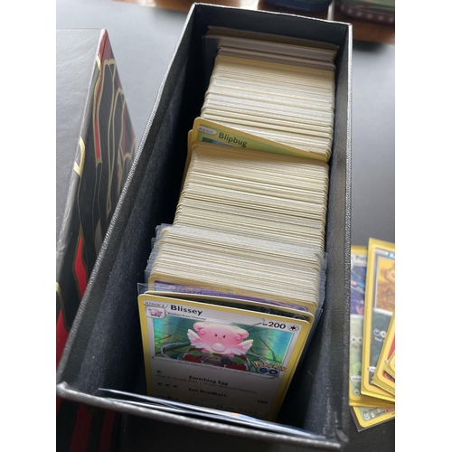 314 - A TRAINER BOX OF ASSORTED POKEMON CARDS, HOLOS, TOKENS ETC