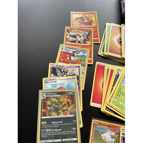 316 - TWO TINS OF ASSORTED POKEMON CARDS, HOLOS, SMALL FOLDER OF CARDS ERC