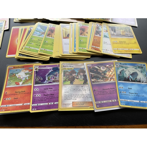 316 - TWO TINS OF ASSORTED POKEMON CARDS, HOLOS, SMALL FOLDER OF CARDS ERC