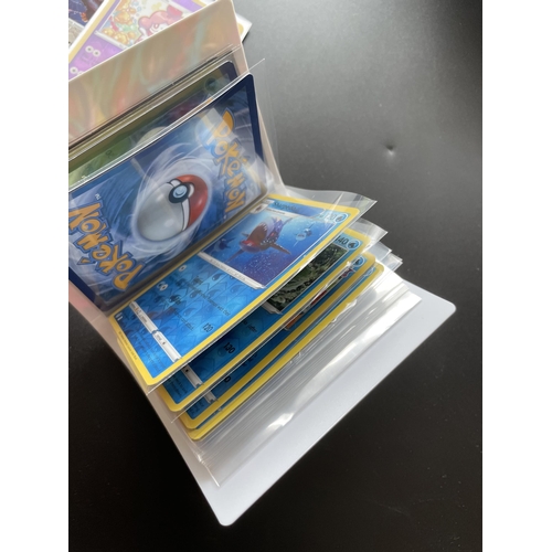 316 - TWO TINS OF ASSORTED POKEMON CARDS, HOLOS, SMALL FOLDER OF CARDS ERC