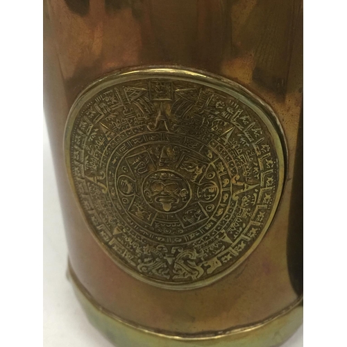 74 - A BRASS AND COPPER TANKARD WITH DOORSTOP