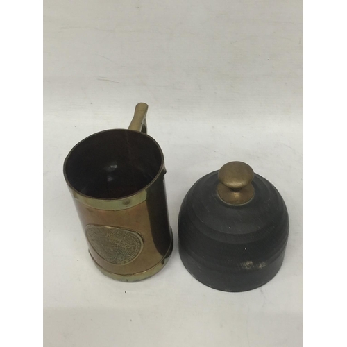 74 - A BRASS AND COPPER TANKARD WITH DOORSTOP
