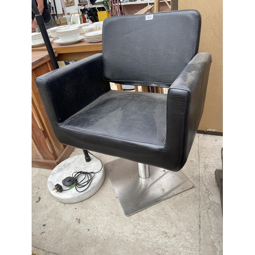 2939 - A BLACK LEATHER SWIVEL PUMP ACTION BARBERS CHAIR ON POLISHED METALWARE BASE