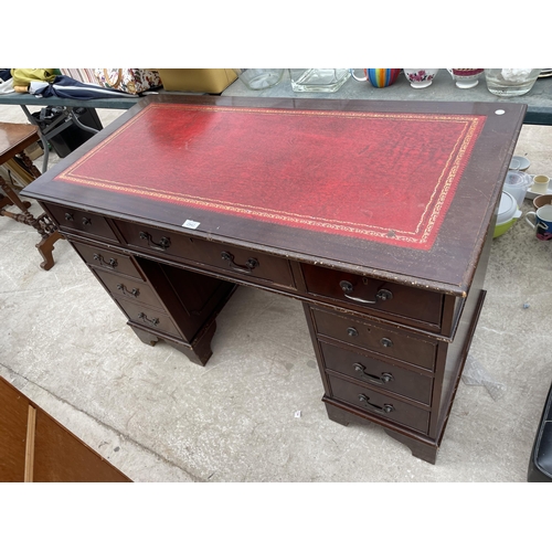 2942 - A MAHOGANY TWIN-PEDESTAL DESK WITH INSERT LEATHER TOP, 48X24