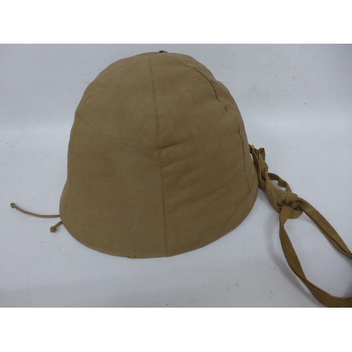 511 - A WORLD WAR II IMPERIAL JAPANESE NAVY COMBAT PAINTED METAL HELMET AND COVER WITH LEATHER LINING