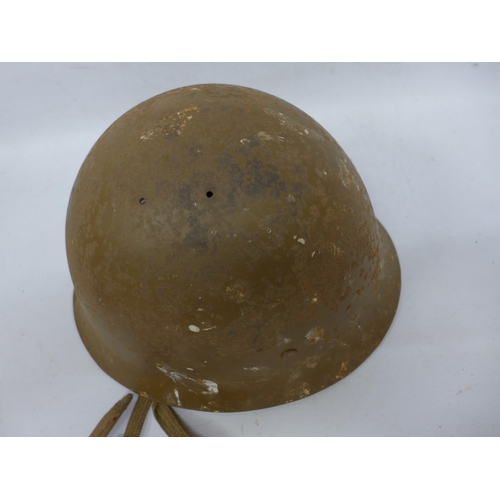 511 - A WORLD WAR II IMPERIAL JAPANESE NAVY COMBAT PAINTED METAL HELMET AND COVER WITH LEATHER LINING