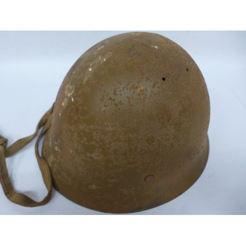 511 - A WORLD WAR II IMPERIAL JAPANESE NAVY COMBAT PAINTED METAL HELMET AND COVER WITH LEATHER LINING