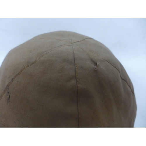 511 - A WORLD WAR II IMPERIAL JAPANESE NAVY COMBAT PAINTED METAL HELMET AND COVER WITH LEATHER LINING