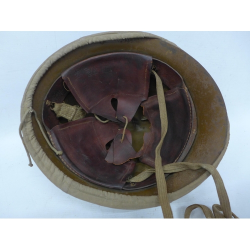 511 - A WORLD WAR II IMPERIAL JAPANESE NAVY COMBAT PAINTED METAL HELMET AND COVER WITH LEATHER LINING