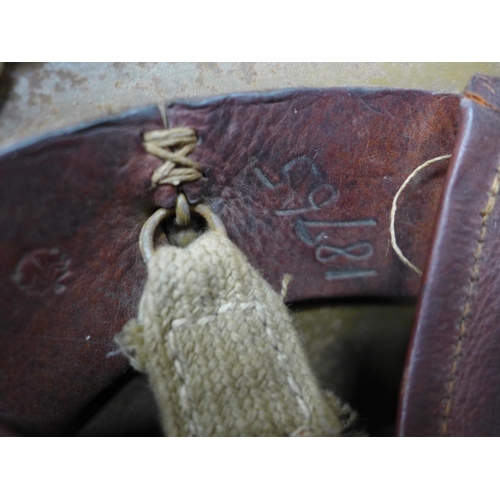 511 - A WORLD WAR II IMPERIAL JAPANESE NAVY COMBAT PAINTED METAL HELMET AND COVER WITH LEATHER LINING