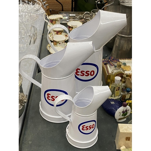 131 - THREE GRADUATED 'ESSO' OIL CANS, HEIGHTS 29CM, 25CM AND 17CM