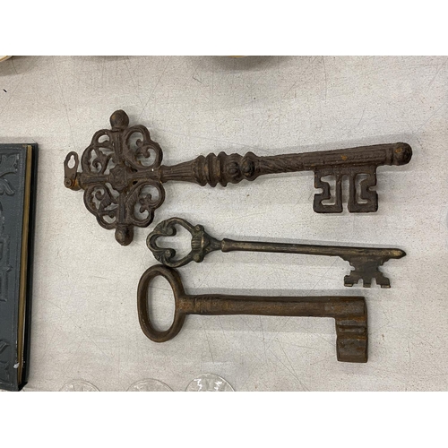 138 - THREE VINTAGE METAL KEYS