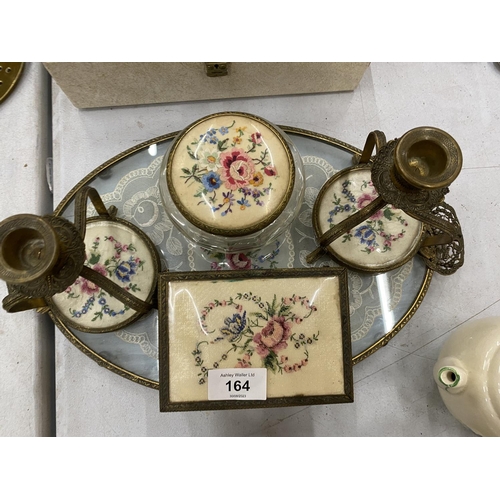 164 - A PETIT POINT DRESSING TABLE SET TO INCLUDE A TRAY, CANDLESTICKS AND TRINKET BOXES