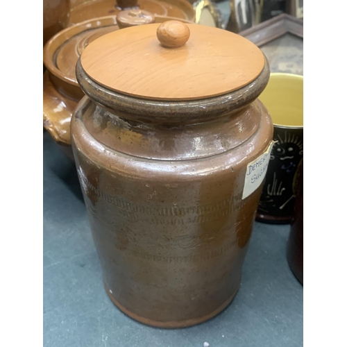 184 - A QUANTITY OF STONEWARE ITEMS TO INCLUDE A LARGE JUG, STORAGE JARS, CASSEROLE DISHES, ETC