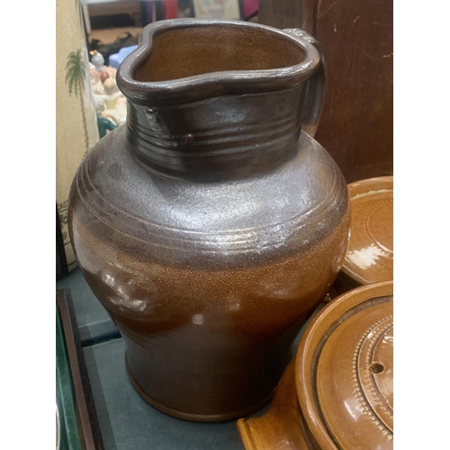 184 - A QUANTITY OF STONEWARE ITEMS TO INCLUDE A LARGE JUG, STORAGE JARS, CASSEROLE DISHES, ETC