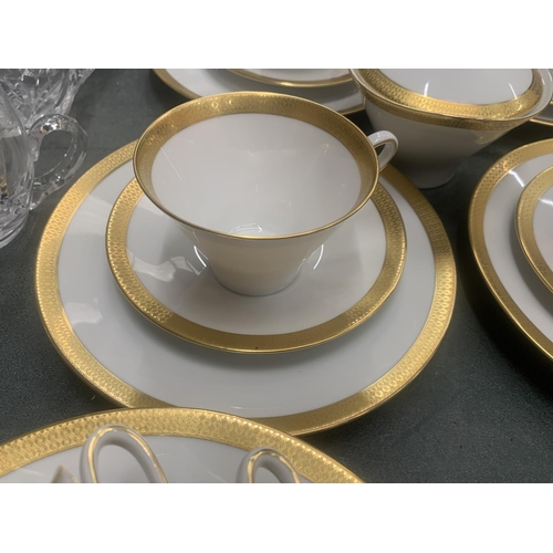 188 - A CHINA PART TEASET IN WHITE WITH GILD TO THE RIMS TO INCLUDE A SUGAR BOWL, CUPS, SAUCERS AND SIDE P... 