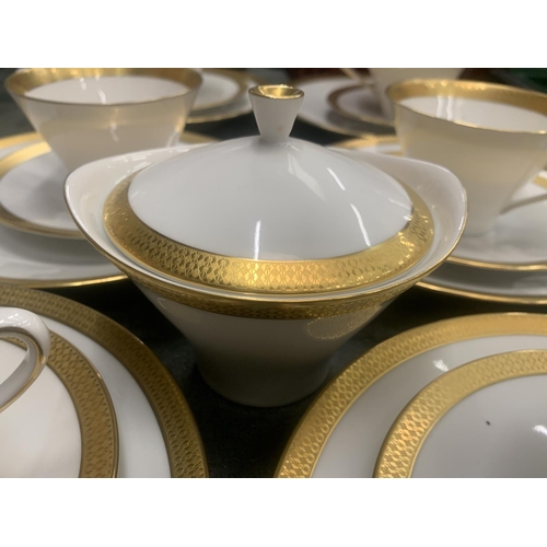 188 - A CHINA PART TEASET IN WHITE WITH GILD TO THE RIMS TO INCLUDE A SUGAR BOWL, CUPS, SAUCERS AND SIDE P... 