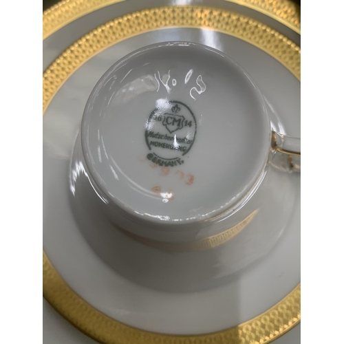 188 - A CHINA PART TEASET IN WHITE WITH GILD TO THE RIMS TO INCLUDE A SUGAR BOWL, CUPS, SAUCERS AND SIDE P... 