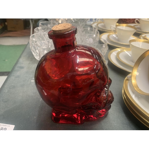 189 - A GLASS RED SKULL NO. 5 SPIRIT DECANTER HEIGHT 16CM