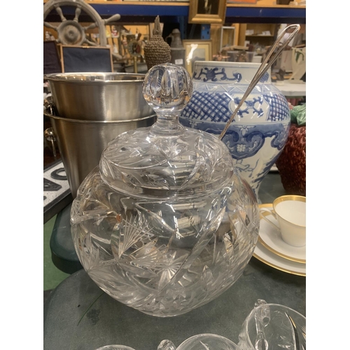 190 - A HEAVY CUT GLASS PUNCH BOWL WITH LID, PUNCH GLASSES AND A STAMPED WMF SILVER PLATED LADEL WITH TWIS... 