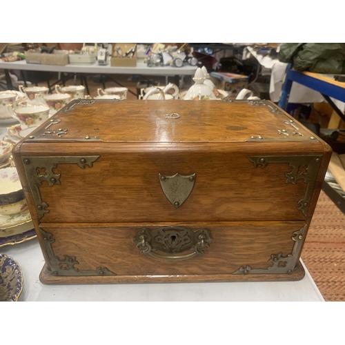 193 - A VICTORIAN GOTHIC OAK SMOKERS CHEST WITH METAL BANDING AND SIDE HANDLES