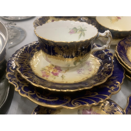 194 - AN ANTIQUE CHINA TEASET TO INCLUDE A SUGAR BOWL, CREAM JUG, CUPS, SAUCERS, AND SIDE PLATES