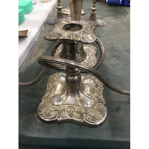 219 - FOUR SILVER PLATED THREE BRANCHED CANDLEABRAS AND TWO CANDLESTICKS