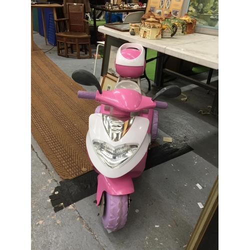 227 - A CHILDREN'S PINK ELECTRIC THREE WHEELED SCOOTER WITH CHARGER - VENDOR STATES IN WORKING ORDER AND V... 