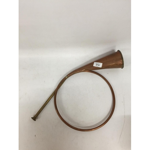 274 - A VINTAGE COILED COPPER HUNTING HORN