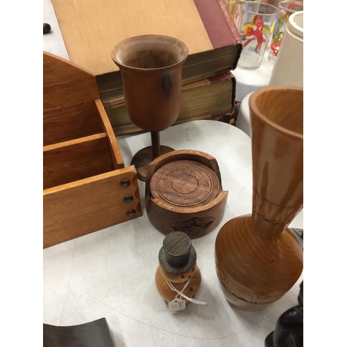 297 - A QUANTITY OF TREEN TO INCLUDE BOOKENDS, CLOCK, FIGURES, LETTER HOLDER, ETC.,